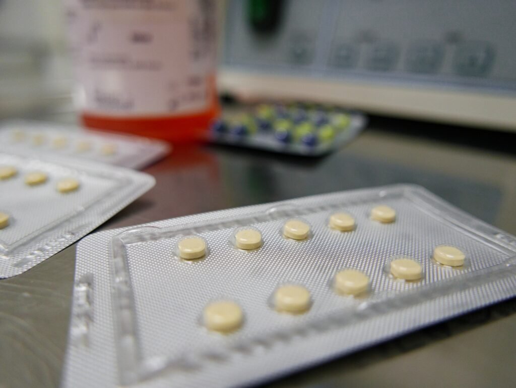 Close-up, selective focus image of pills on counter.