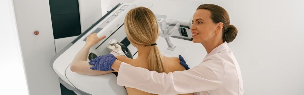 Professional radiologist doing mammogram x ray for young woman to check for breast cancer