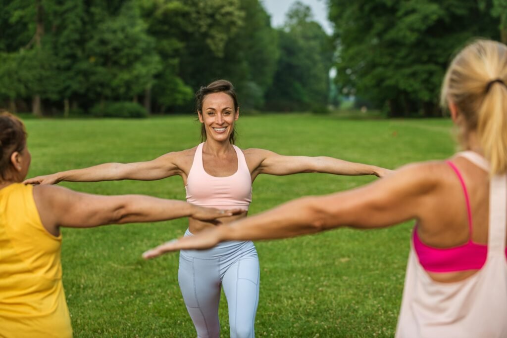 Senior women training with fitness coach at park