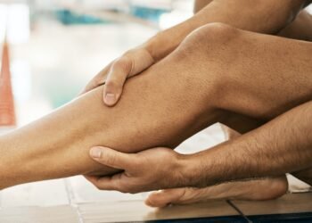 Legs injury, swimming and sports person massage calf problem from exercise, training or workout cri