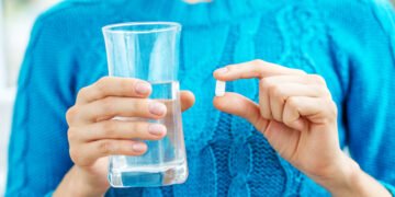 Receiving vitamins. Concept illness, colds, cure, fall and winte