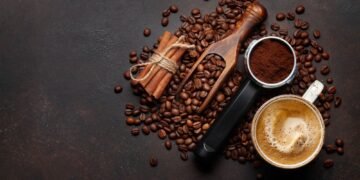 Roasted coffee beans and ground coffee in filter holder